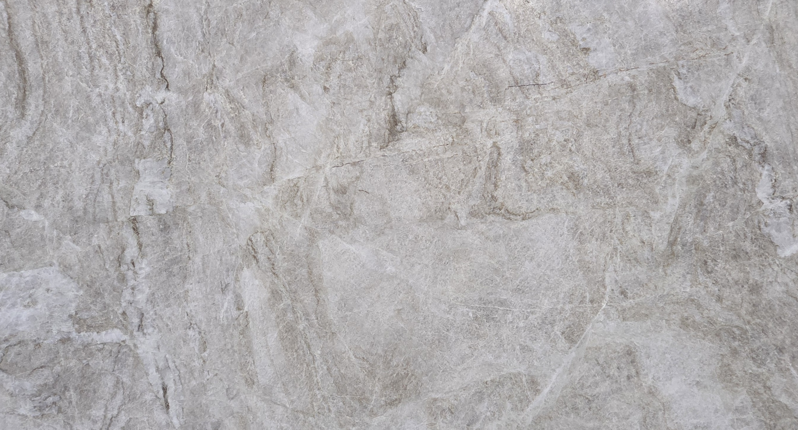 Taj Mahal quartzite slab with soft beige tones for kitchen countertops and bathroom vanities